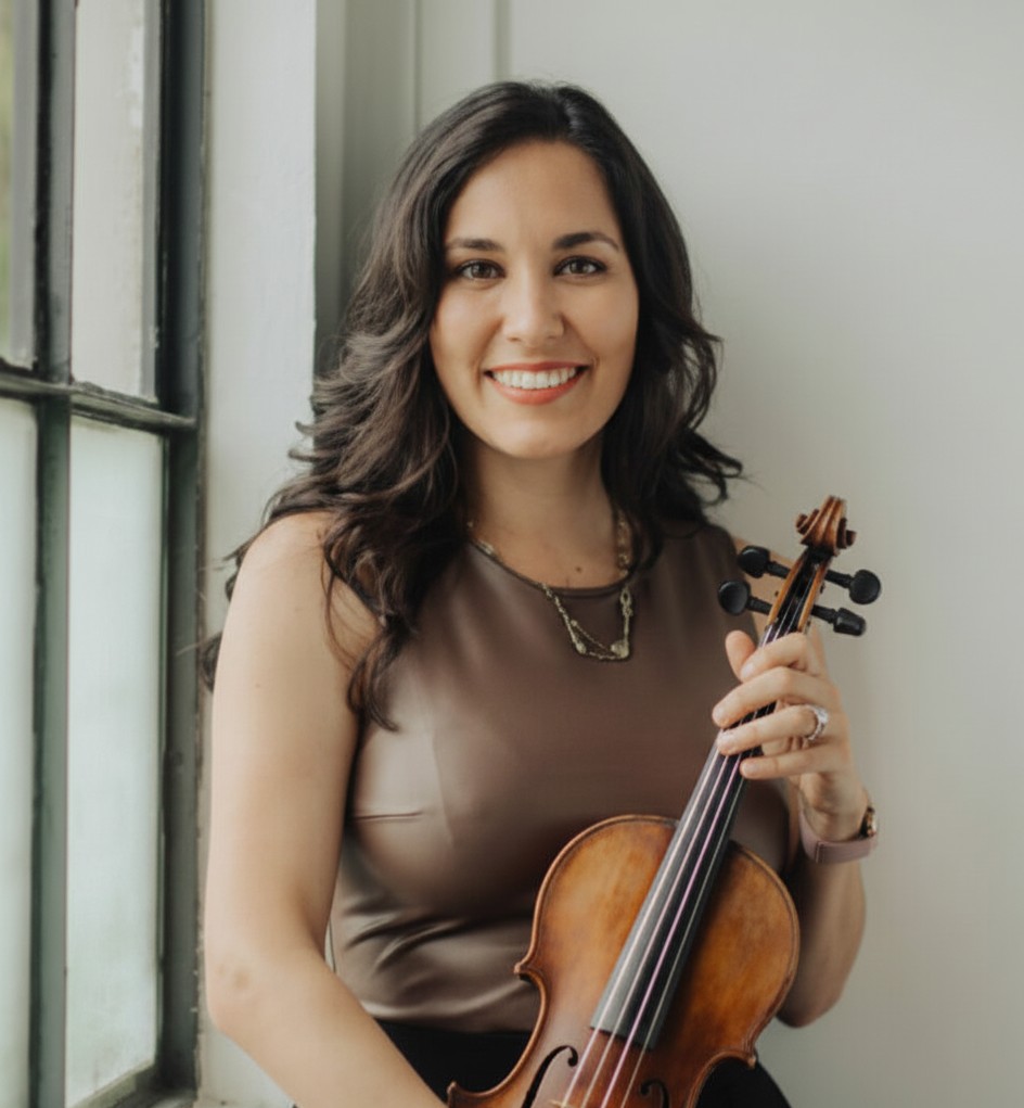 Professional portrait of Rosie Riquelme Antunez, founder of Lumina String Ensemble, holding a violin.